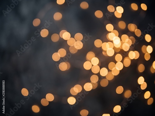 Bokeh lights photo, glowing golden abstract background with soft blur and warm illumination
