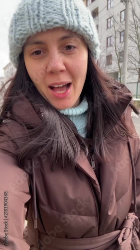 Woman talking outdoors in winter