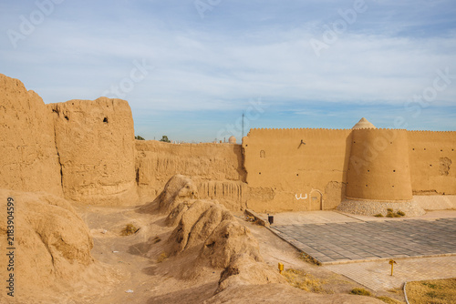 Jalali Castle, Arg-e Jalali, ancient mudbrick fortress in Kashan, Iran, with massive earthen walls, towers and eroded defensive structures. Traditional Persian historic architecture