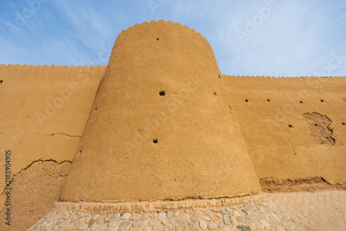 Jalali Castle, Arg-e Jalali, ancient mudbrick fortress in Kashan, Iran, with massive earthen walls, towers and eroded defensive structures. Traditional Persian historic architecture