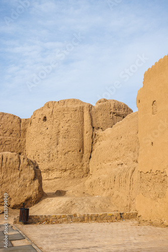 Jalali Castle, Arg-e Jalali, ancient mudbrick fortress in Kashan, Iran, with massive earthen walls, towers and eroded defensive structures. Traditional Persian historic architecture
