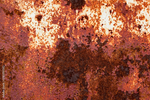 Quadro su tela Close-up view of a heavily rusted metal surface displaying various shades of orange, brown, and red