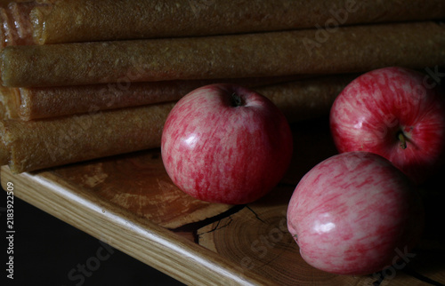 Juicy apples on a textured table with a dark background.