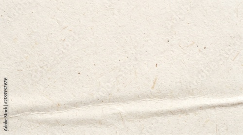 Textured off-white paper with subtle folds and fibers paper, texture, background