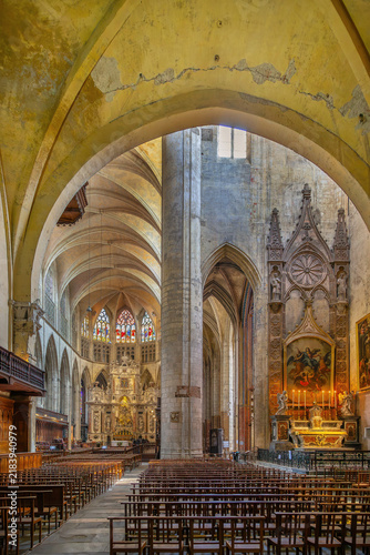 Interior view of Toulouse Cathedral, France. Perspective from crossing vault towards the main altar and a side chapel