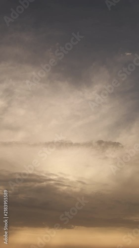 Time lapse of dramatic clouds moving across sky at sunset