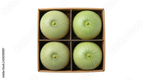 Four fresh green cantaloupe melons arranged in a square cardboard gift box