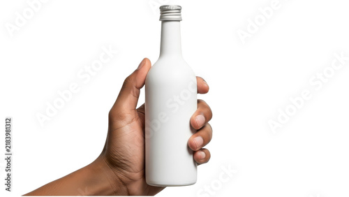 A person holding a small blank white metal bottle for branding or product design