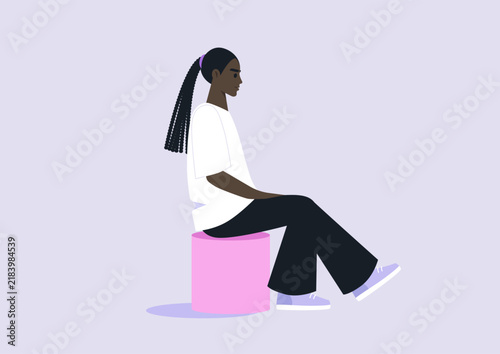 In a cozy, modern space, a person sits thoughtfully on a bright pouf, Their relaxed posture reflects a moment of introspection, surrounded by soft pastel colors that create a peaceful atmosphere.