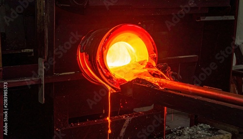 Vibrant molten glass pouring from industrial furnace with glowing orange hues