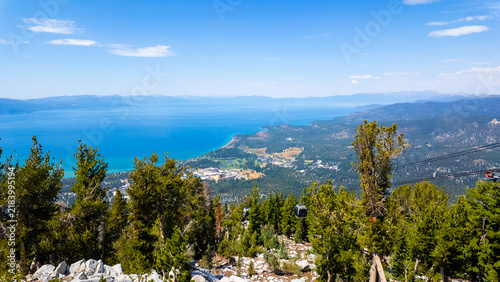 A view of Lake Tahoe, California, from the top of the mountain in the Sierra Nevada with South Lake Tahoe Below after a Ski Lift Ride