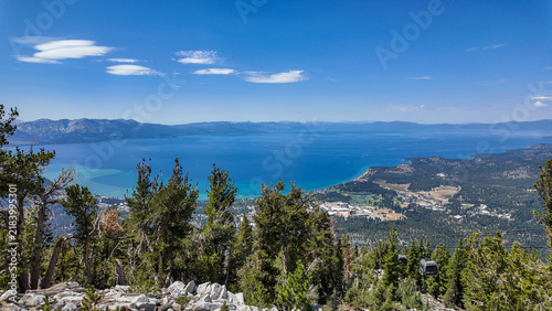 A view of Lake Tahoe, California, from the top of the mountain in the Sierra Nevada with South Lake Tahoe Below after a Ski Lift Ride