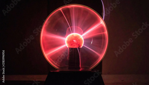 Intense Red Plasma Ball With Energetic Light Beams Emanating From A Central Sphere