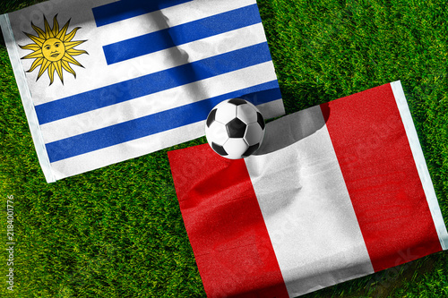 Fotografie Uruguay vs Peru soccer and football match background concept with national flags