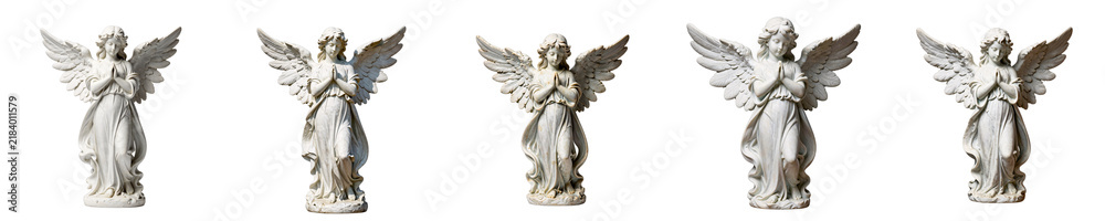 Fototapeta premium Five angel statues of white stone are seen against black background, representing spirituality