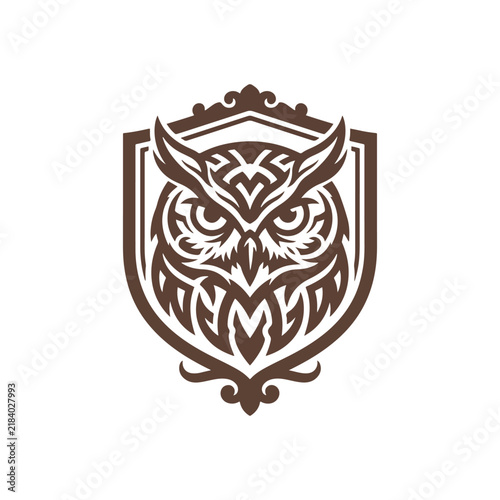 Tribal owl emblem inside ornate decorative heraldic shield with heraldic decorative predator wildlife strength isolated detailing creative