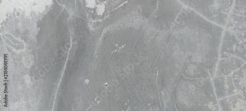 Bild auf Leinwand Troweled grey concrete wall texture with fine diagonal striations and delicate h