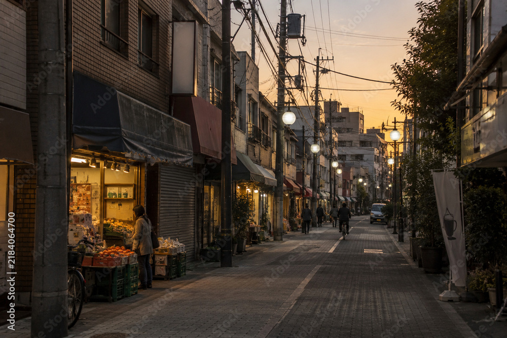 Fototapeta premium Japanese Local Shopping Street at Sunset with Warm Evening Light