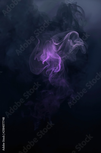 Dark mystical smoke background with soft central light and atmospheric volumetric fog