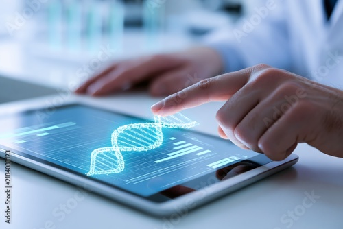 Futuristic scientific concept showing a human hand interacting with a glowing digital DNA double helix on a tablet screen. Advanced genetic sequencing and bioengineering technology.
