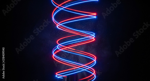 Intersecting red and blue neon linear data spirals