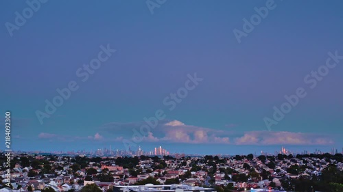 4K Aerial video panorama of Lyndhurst New Jersey suburban neighborhood at twilight with New York City skyline in distance