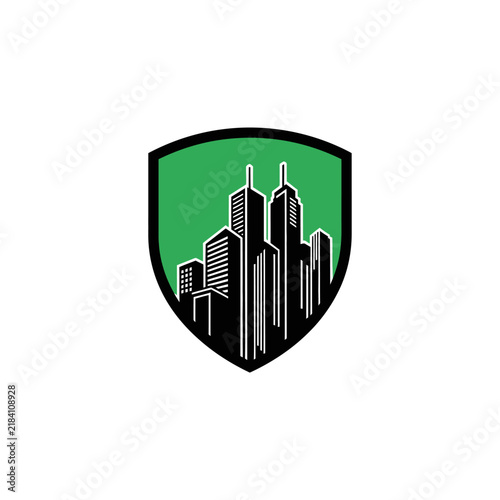 Modern Cityscape Silhouette Inside A Protective Green Shield Emblem