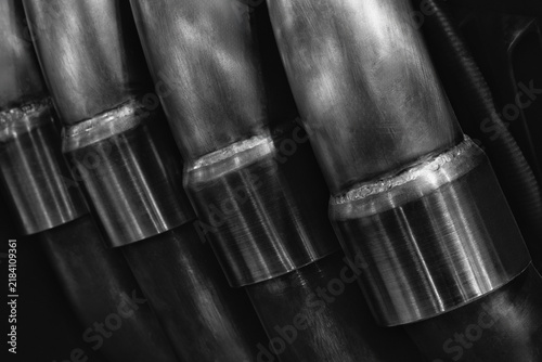 фотографія Close-up of cylindrical metal tubes with welded joints