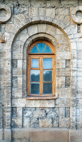 Obraz na płótnie The window of the old mansion 19 century with brown bricks wall