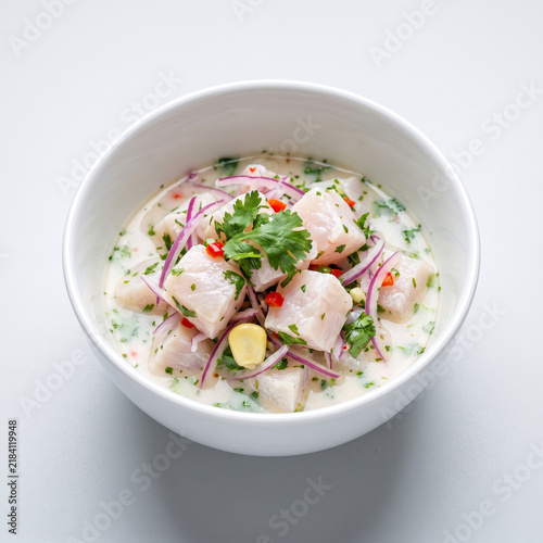 Fresh peruvian ceviche bowl with raw fish and lime juice