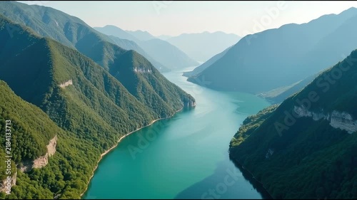 Serene lake surrounded by mountains, perfect for outdoor activities