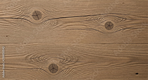 Wooden plank background with natural wood grain texture and knots.