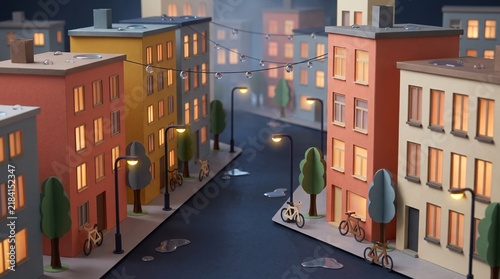 Colorful paper crafted miniature city street featuring small cardboard buildings with illuminated windows warm glowing streetlights and tiny wooden bicycles parked on a wet surface