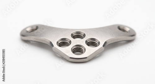 Veterinary TPLO bone plate, implant-grade titanium surgical hardware for tibial plateau leveling osteotomy. Precision orthopedic implant isolated on white background.