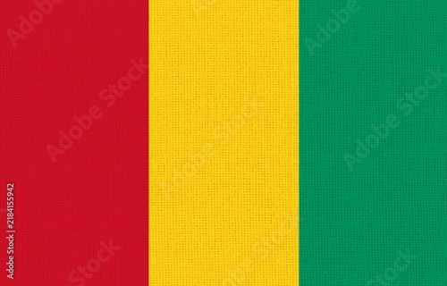 Official national flag of Guinea on fabric texture - 3D illustration