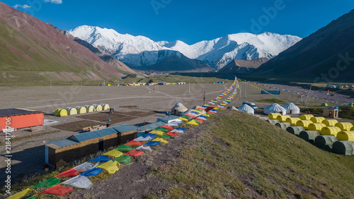 Mountain Base Camp with Tents and Prayer Flags in the Pamir Mountains