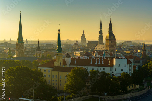Aerial panoramic view of Old Riga during sunrise in summer, Riga Castle in foreground