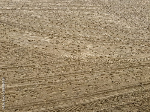 Empty beach chairs lining la concha beach