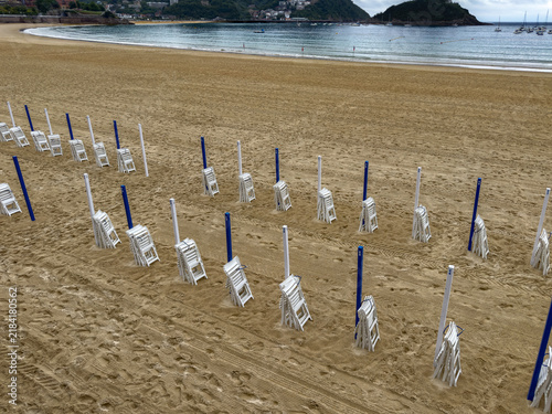 concha beach chairs anLad poles preparing for summer