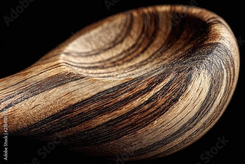 A high quality photo of a wooden spoon emphasizing