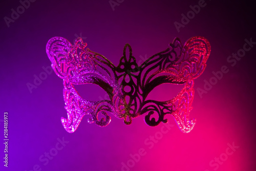 Halloween or carnival mask on black