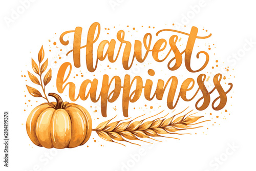 Golden autumn pumpkin beside wheat stalks