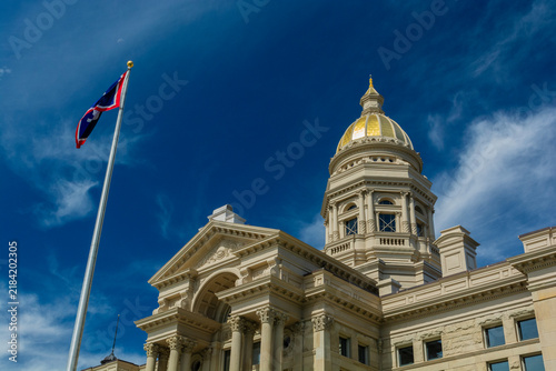 Wyoming State Capitol Building on a Sunny Day with the State Flag Blowing in the Breeze
