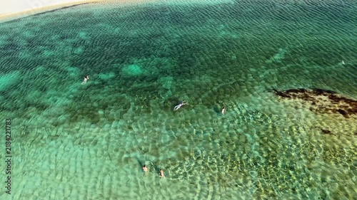 Aerial drone view of clear shallow water over a sandy bottom in a lagoon between the dunes, Lencois Maranhenses, Brazil