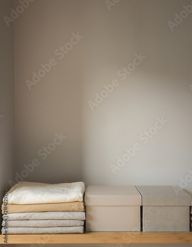 Year-end reset organized living with folded linens and neutral storage boxes