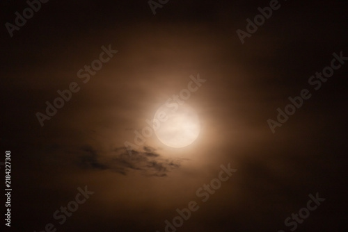  Full moon in the night sky with clouds