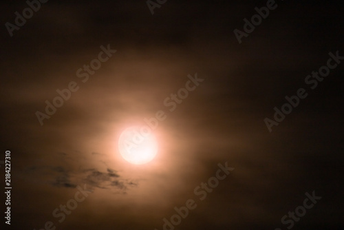  Full moon in the night sky with clouds