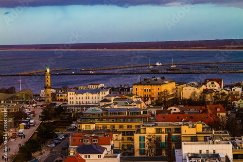 Coastal Town With Lighthouse And Harbor