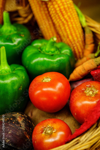 Fresh vegetables in a woven basket displayed at a local market