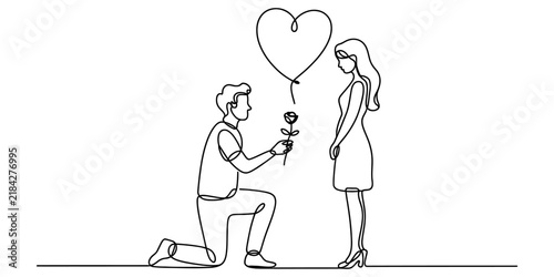 Photography Man proposing to woman with rose and heart balloon, symbolizing love and marriage proposal in a romantic gesture